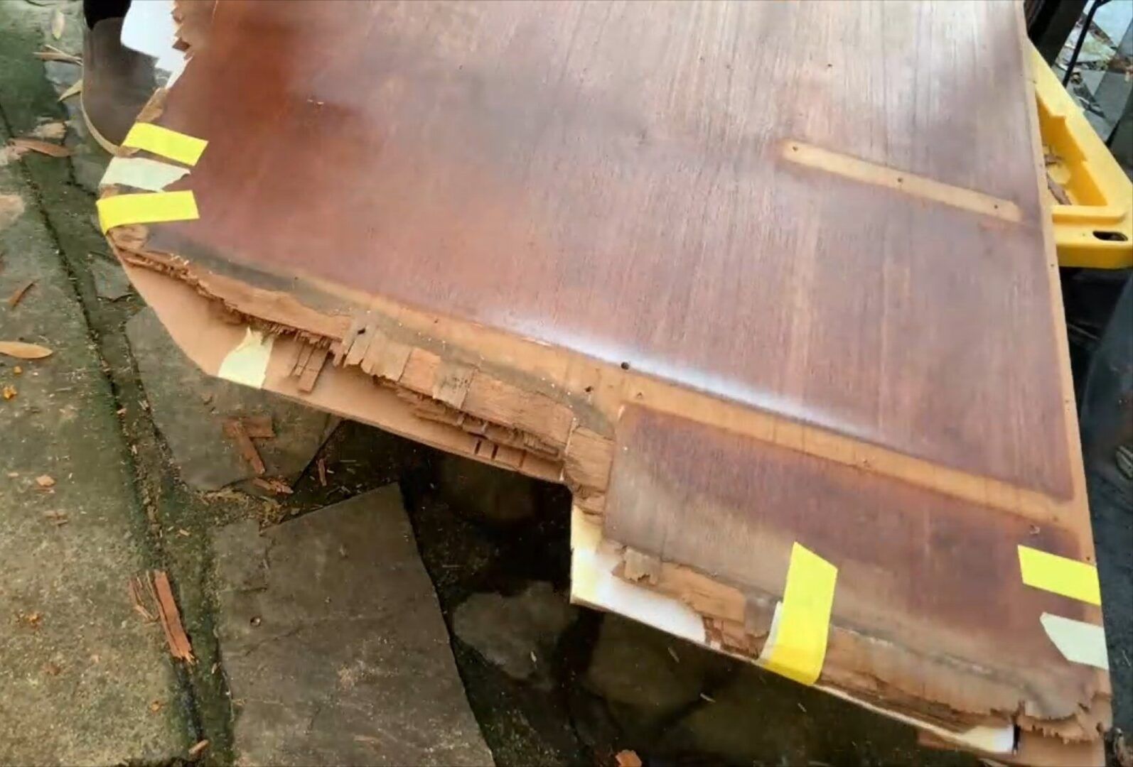 Marking the bulkhead sections that need to be extended due to rot. (Photo/ Steve Milan)