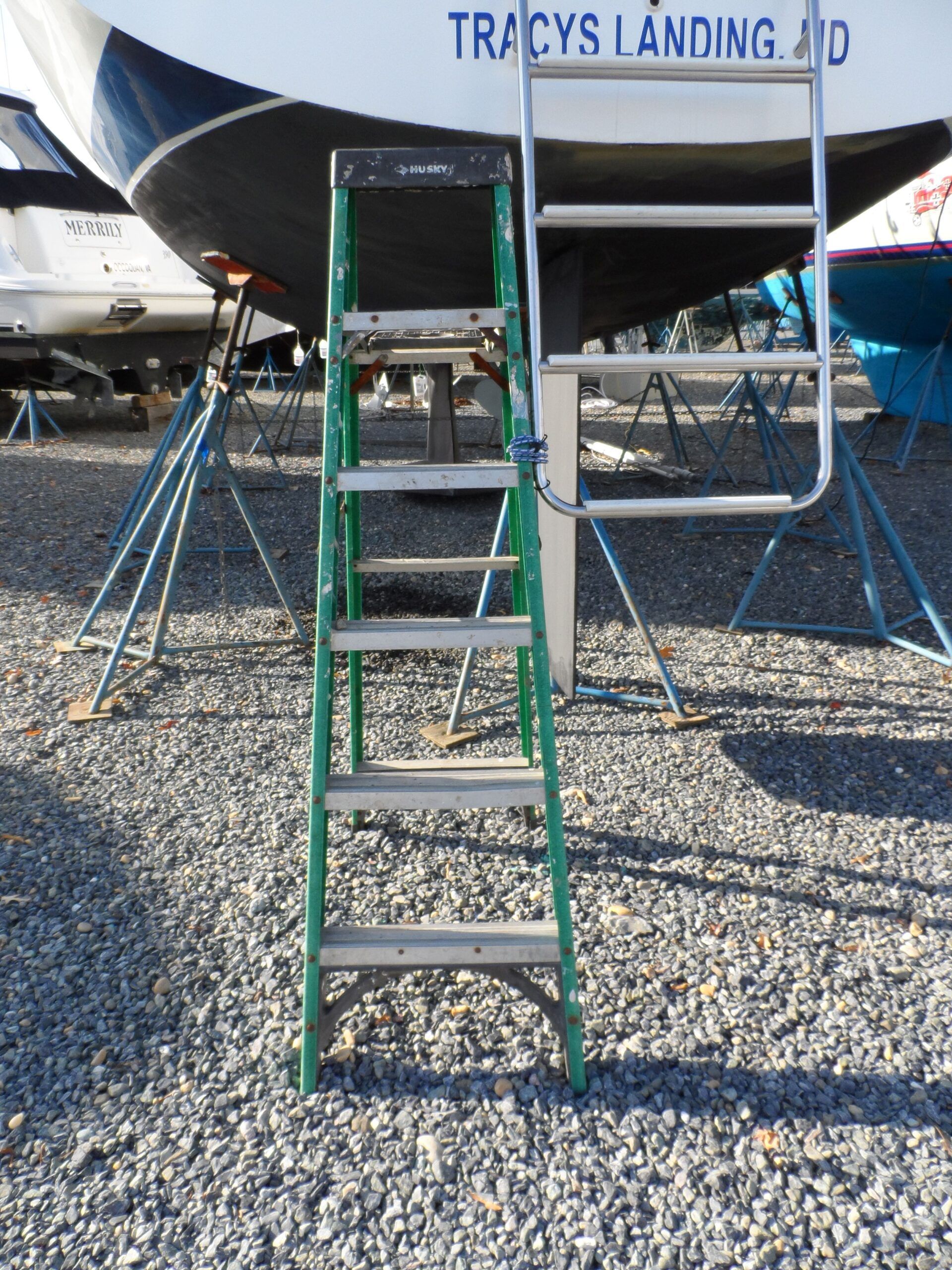 Tie off the boat yard ladder, every time. Even the most agile can fall when the ladder shifts due to rough gravel or a miss step while carrying a load. (Photo/ Drew Frye)