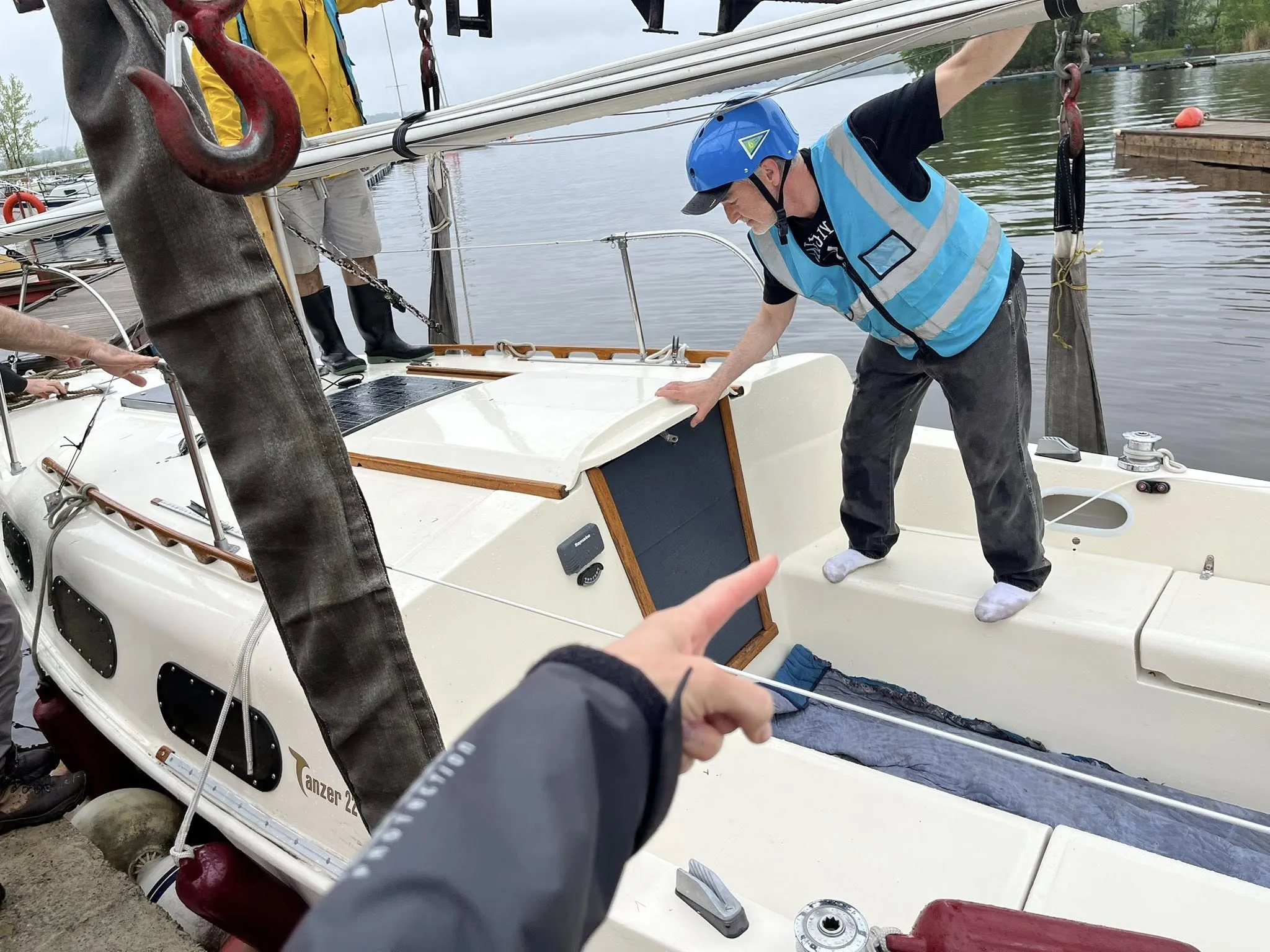 Haul-out team looking for where the slings need to be located. (Photo/ Marc Robic)