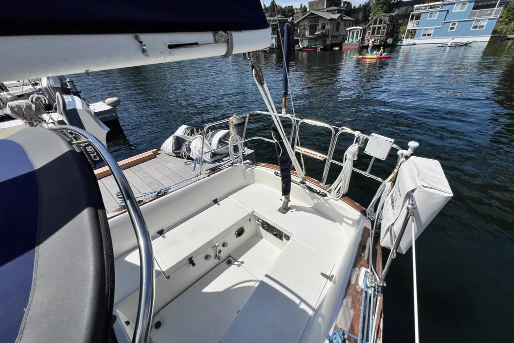 The Dana's cockpit prioritizes sailing comfort with 6-ft. 3-in. seats that allow crew to sleep outside during stifling nights below. The long tiller tilts up when not in use, while the traveler's transom location keeps the mainsheet fall clear of the working area. Courtesy of Yachtworld.com