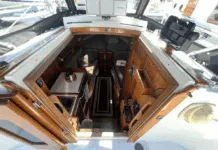 Despite her compact size, the Dana 24 offers genuine 6-ft. headroom in the saloon and sleeping space for two 6-ft. 2-in. adults in the V-berth. Hand-rubbed oiled teak surfaces, bronze ports, and the absence of a forward bulkhead creates surprising spaciousness. Courtesy of Yachtworld.com