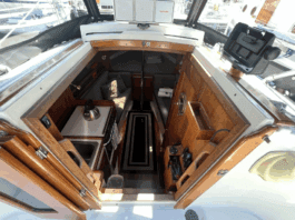Despite her compact size, the Dana 24 offers genuine 6-ft. headroom in the saloon and sleeping space for two 6-ft. 2-in. adults in the V-berth. Hand-rubbed oiled teak surfaces, bronze ports, and the absence of a forward bulkhead creates surprising spaciousness. Courtesy of Yachtworld.com
