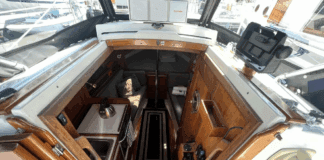 Despite her compact size, the Dana 24 offers genuine 6-ft. headroom in the saloon and sleeping space for two 6-ft. 2-in. adults in the V-berth. Hand-rubbed oiled teak surfaces, bronze ports, and the absence of a forward bulkhead creates surprising spaciousness. Courtesy of Yachtworld.com