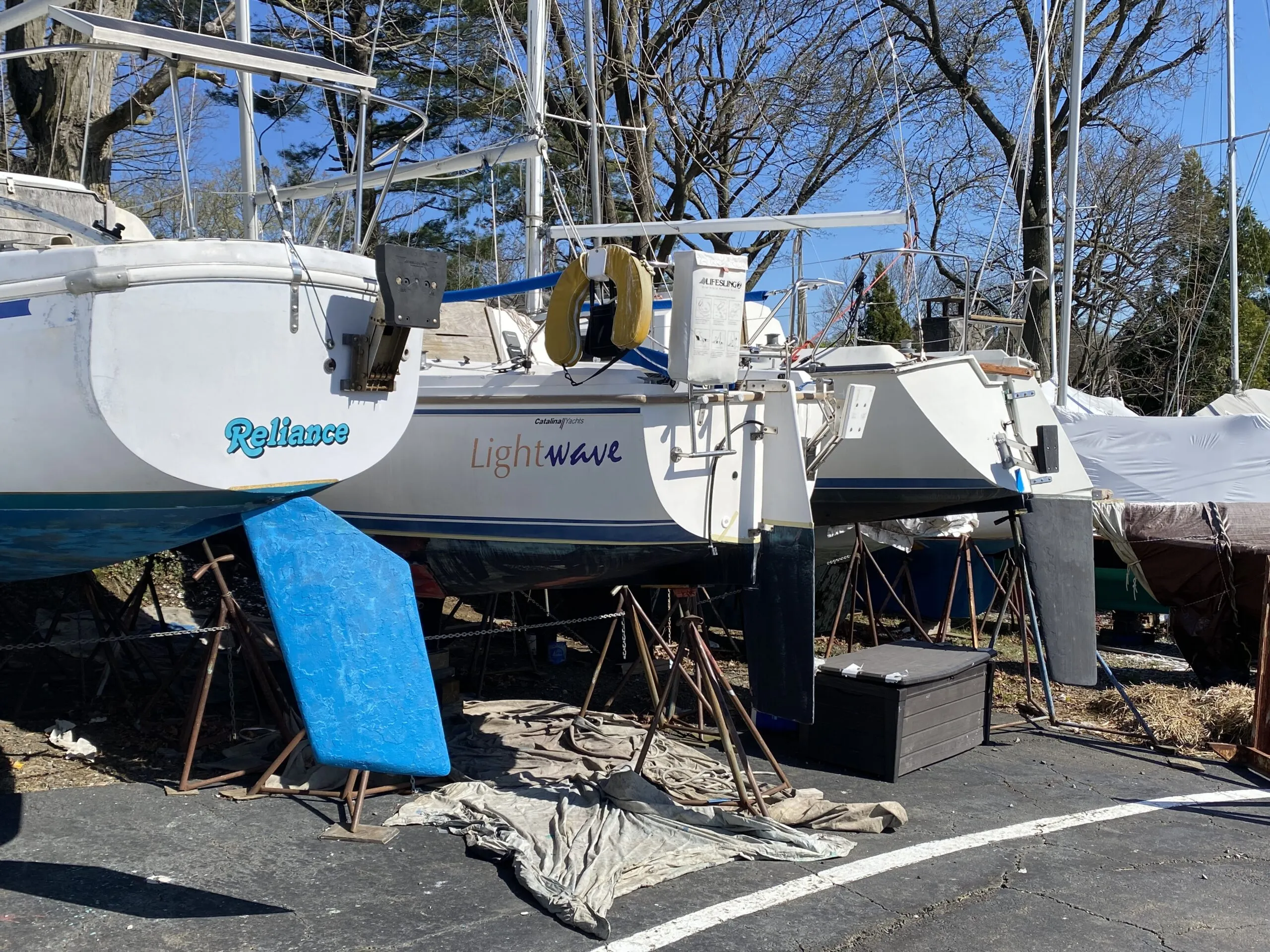 A trio of cruising sailboats with outboard brackets await re-installation of their engines after winter storage. The boats are, left to right, a Columbia 26 MK 2, a Catalina 25, and a C&C 27 MK V. The Columbia and C&C were likely converted to outboard power after the failure of their original (likely Atomic 4 gas) inboards. Outboards offer a low-cost repower option for boats of this size compared to replacing an inboard. (Photo/ Doug Henschen)