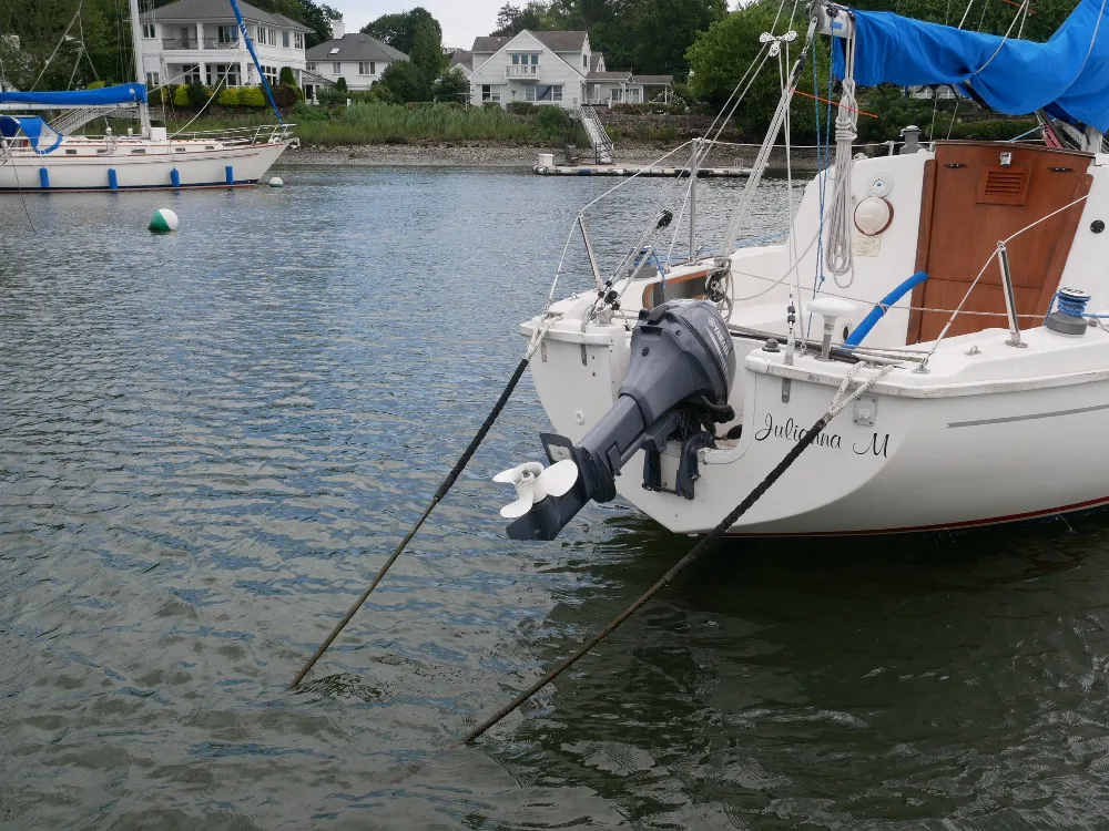 The popular Pearson 26 with a Yamaha 9.9 hp motor, was designed for outboard power, with a cut-down transom and motor well. (Photo/ Doug Henschen) 