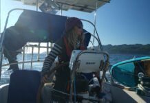 The author helming out of the Juan De Fuca at the start of the trip into the Pacific. (Photo/ Jaclyn Jeffrey)