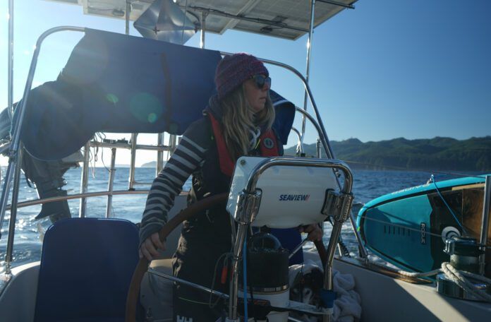 The author helming out of the Juan De Fuca at the start of the trip into the Pacific. (Photo/ Jaclyn Jeffrey)