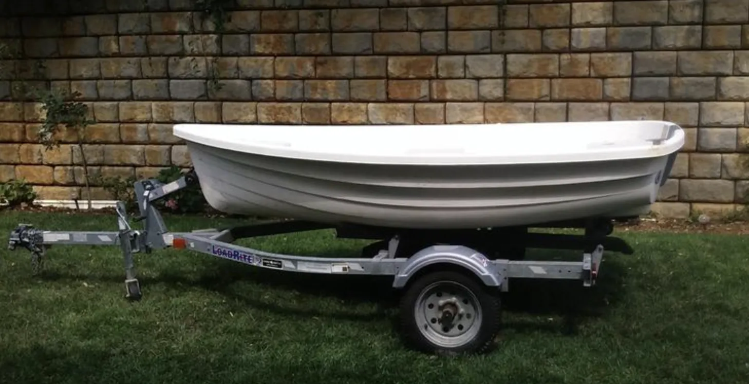 The larger Walker Bay 10 carries more sail area (46 sq. ft.) and accommodates up to three crew members, making it suitable for serious dinghy cruising. However, the 10 required careful weight distribution to achieve proper sailing trim, particularly in stronger winds above 10 knots. Photo courtesy of SailboatListings.com