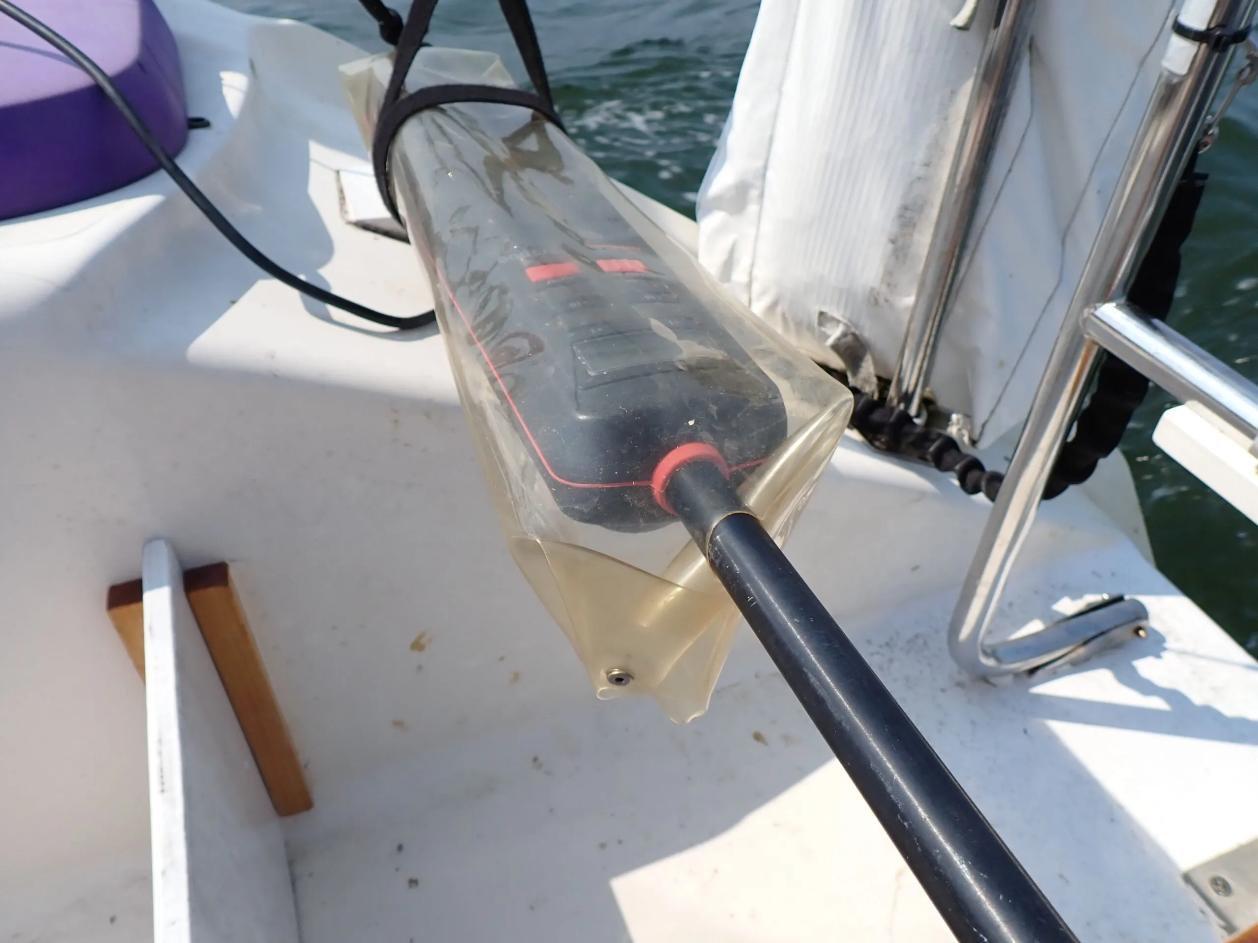 No-sew DIY version made from a recycled dodger window. Just pop-rivets, washers, and a pair of scissors. Great for protecting the tiller pilot from rain. (Photo/ Drew Frye)