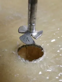 Modified roofing nail for core removal. Compared to a bent finishing nail it runs much smoother in the drill, minimizing jumping. It cleans the top and bottom surfaces more completely. It chops the core into finer bits for easier removal, and the propeller shape transports the dust up and out of the hole, minimizing blowing and picking. (Photo/ Drew Frye)