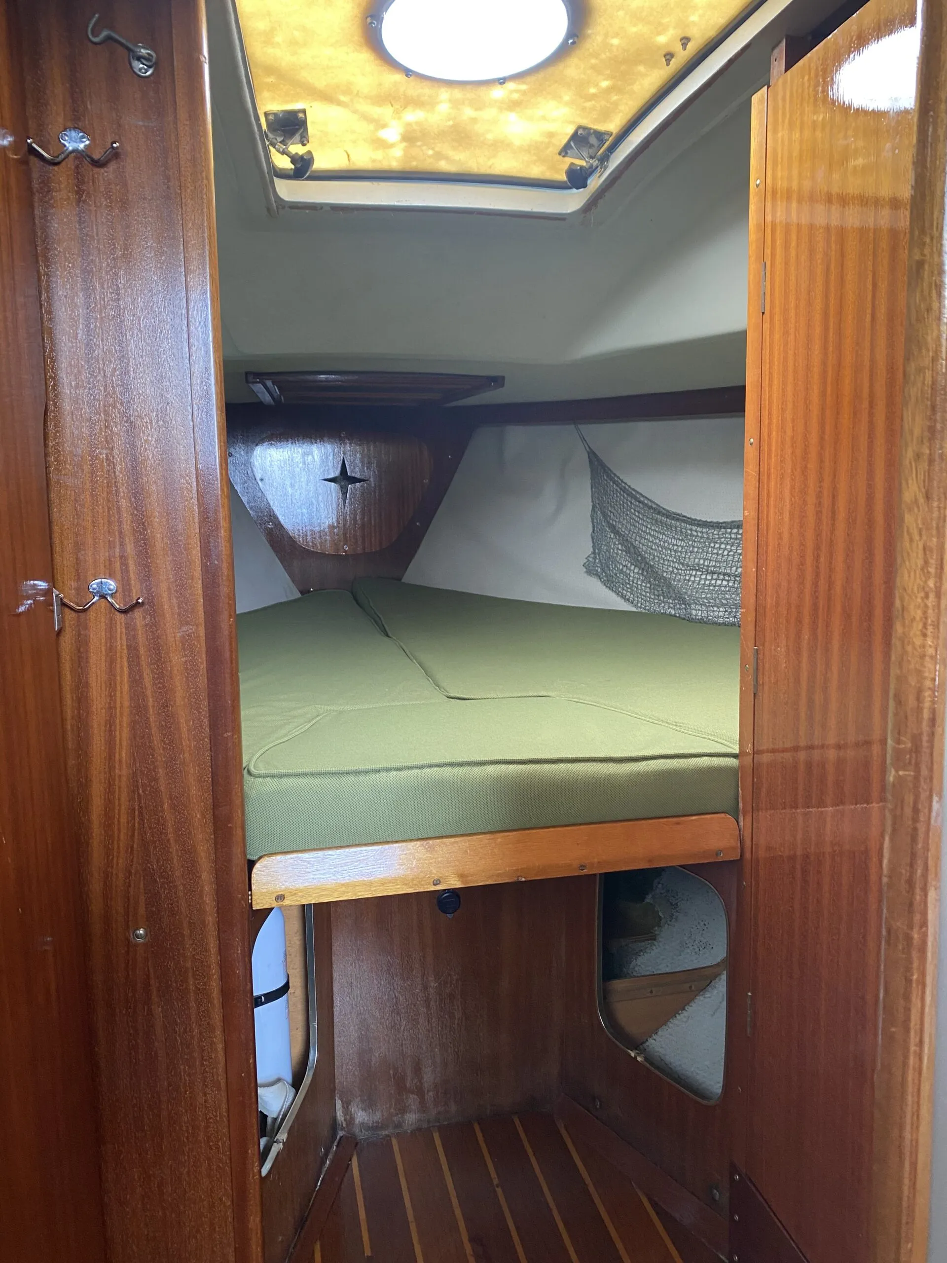The Ballad forecabin, which has only 4-ft. 10-in. of headroom, features a concealed head to starboard and a concealed hanging locker to port. (Photo/ Doug Henschen)
