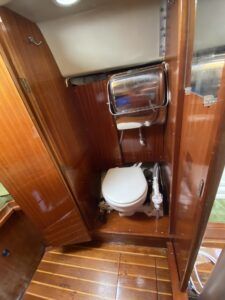 The head compartment is concealed from the salon by the bi-fold hanging locker door, which swings into place and closes with a magnet catch. (Photo/ Doug Henschen)