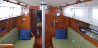 The Ballad salon offers plenty of light. Some models, like the one pictured, have upgraded teak and holly soles. Ventilation is limited to two passive overhead vents. Marius Draeger has upgraded his boat with opening rear windows, available from an aftermarket supplier in Denmark, the capital of Ballad ownership. (Photo/ Doug Henschen)