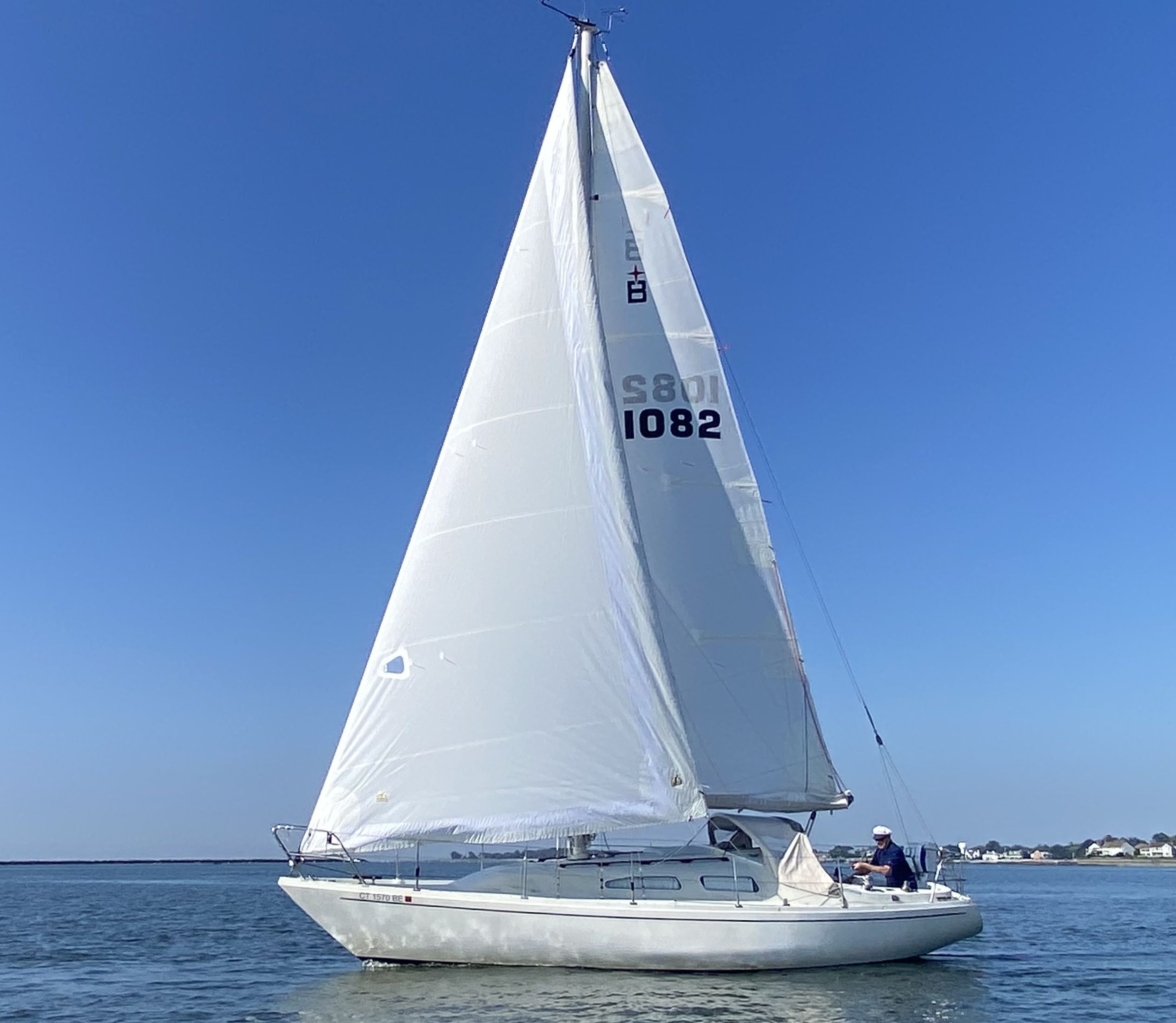 The author’s 1976 Albin Ballad, with former Ballad owner Hal Wolkin at the helm, heading out of Connecticut’s Stamford Harbor in light air. (Photo/ Doug Henschen)