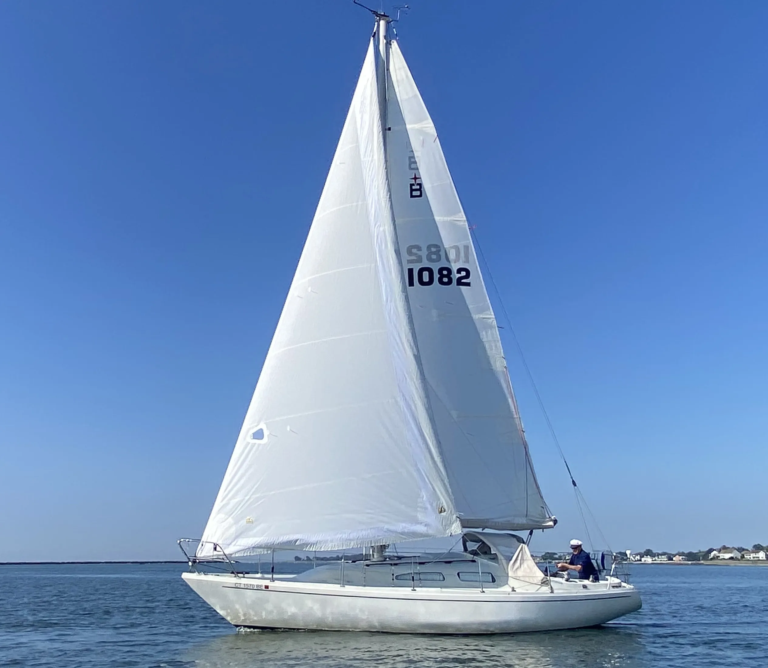The author’s 1976 Albin Ballad, with former Ballad owner Hal Wolkin at the helm, heading out of Connecticut’s Stamford Harbor in light air. (Photo/ Doug Henschen)
