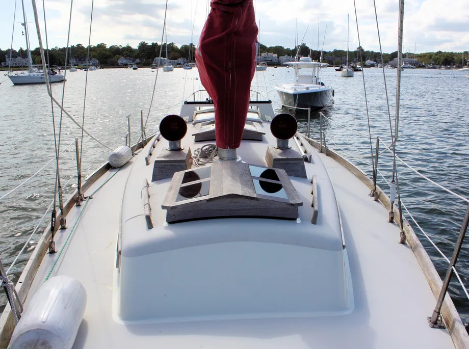 You can see why the Bristol feels so roomy down below: that narrow, relatively low cabin house means most of the boat's volume is tucked down where you live. The compact foredeck and minimal topside clutter are telltale signs of her CCA heritage. Courtesy of YachtWorld.com
