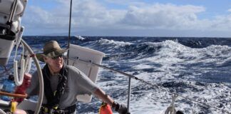 Skipper Chris Read at the helm, going to weather just north of Maui. (Photo/ Bert Vermeer)