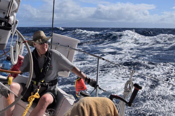 Skipper Chris Read at the helm, going to weather just north of Maui. (Photo/ Bert Vermeer)