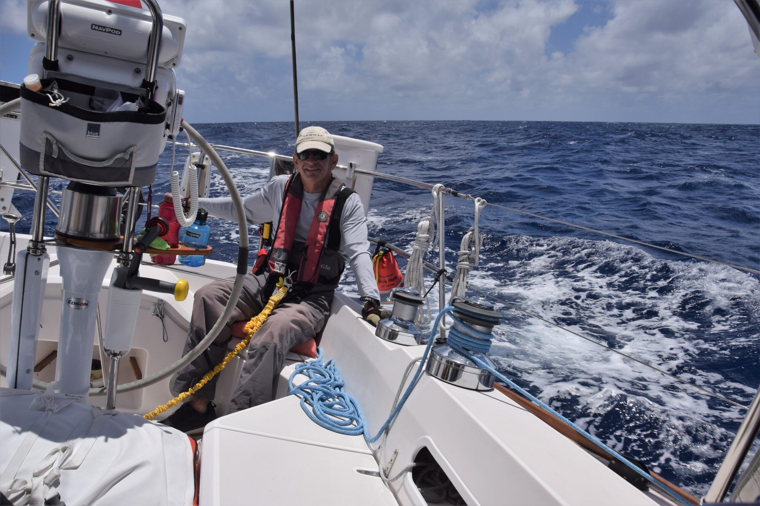 Rick Wunderlich at the helm, just north of Maui, 2,700 nm to go! (Photo/ Bert Vermeer)