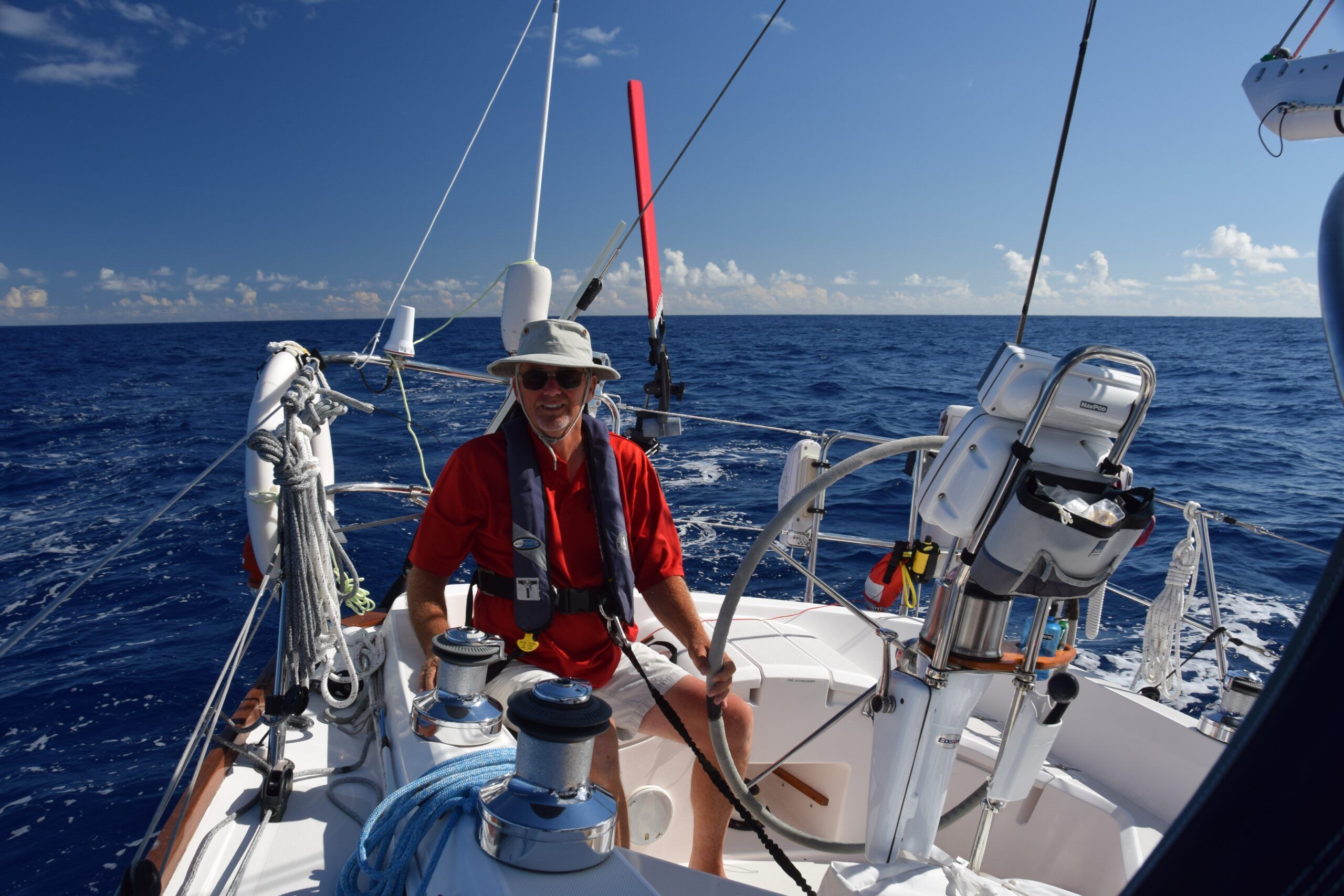 Author, Bert Vermeer, enjoying a spectacular day in mid Pacific, a sailor’s dream! (Photo/ Bert Vermeer)