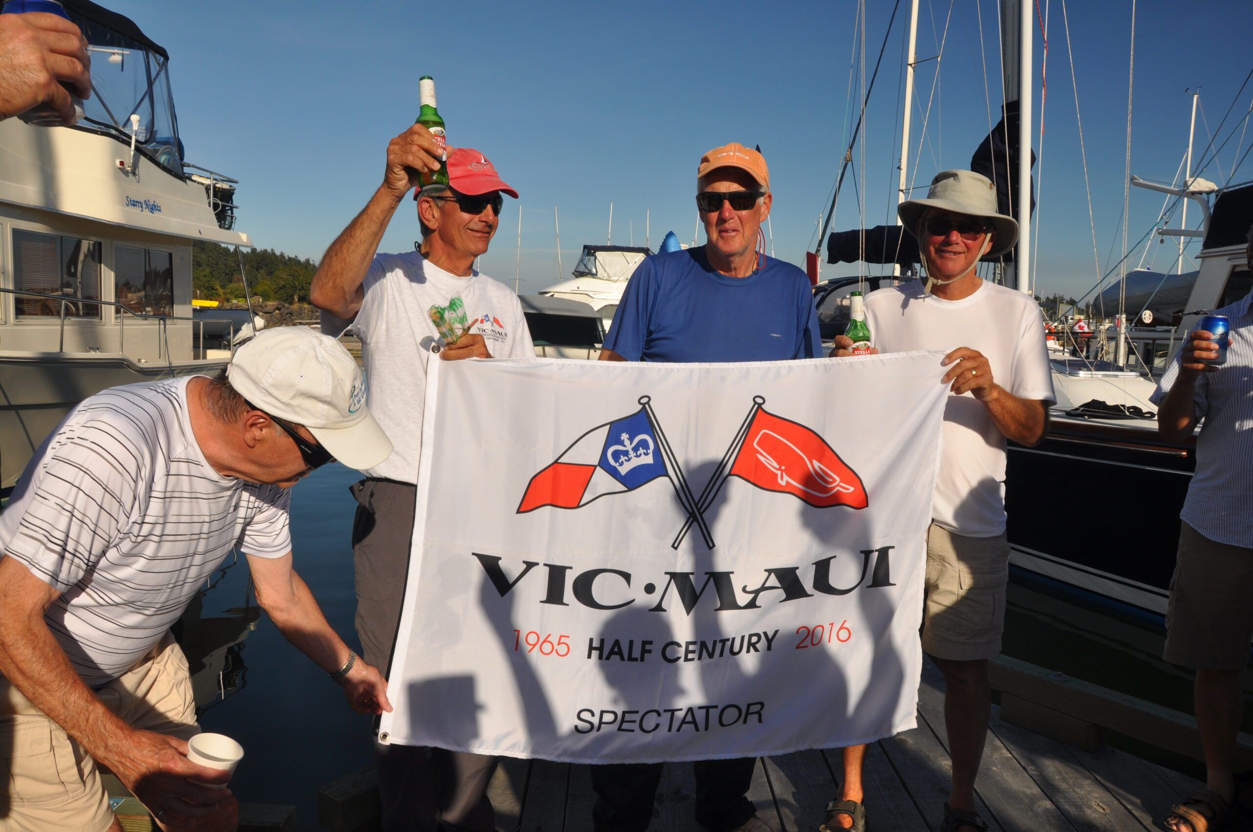 The intrepid sailors back at home port in Sidney on Vancouver Island with a small welcome home dock party. (Photo/ Bert Vermeer)