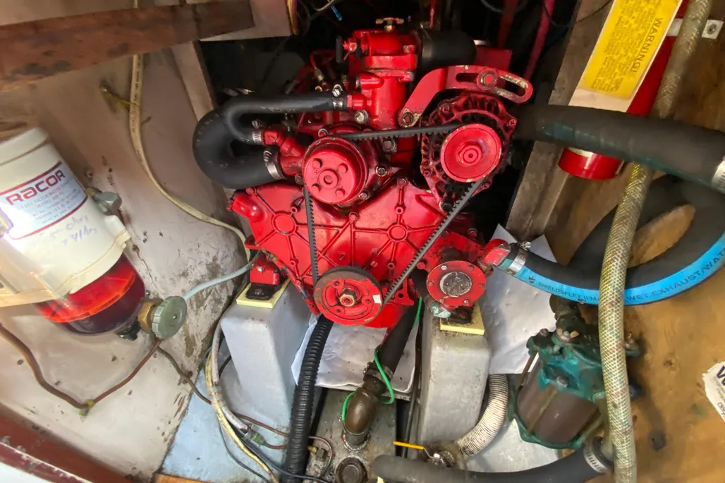 The Westerbeke 4-99 diesel, installed in over half of existing Pilots as a replacement for original gas engines, provides reliable cruising power at 6 knots or better, though steering in reverse remains difficult. Courtesy of YachtWorld.com