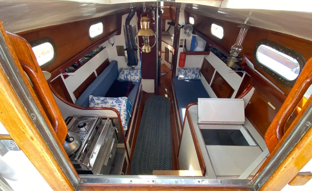 Hinckley sheathed the fiberglass hull with Philippine mahogany to create warm, traditional accommodations and banish the "ice box feel" common in early fiberglass designs. Courtesy of YachtWorld.com