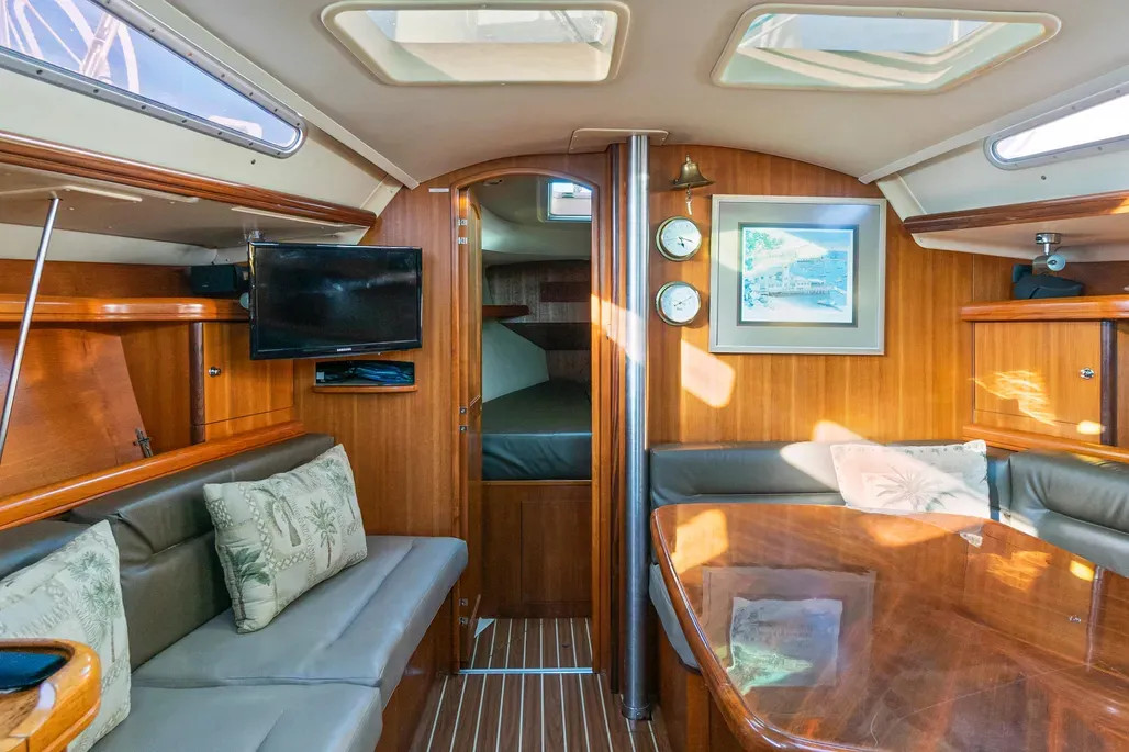 Twin 24-in. x 24-in. Lewmar hatches and elongated 16-in. x 28-in. tinted plexiglass ports provide ventilation and natural light—critical in a 38-footer designed for extended cruising. Teak joinery shows improved fit and finish compared to earlier models thanks to computerized cutting tools. Courtesy of YachtWorld.com