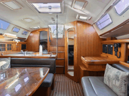 Hunter 38 Used Boat Review The main saloon offers 6-ft. 6-in. headroom with teak cabinetry, solid wood handrails, and settees that seat six around a 36-in. x 42-in. dining table. The low-maintenance Everwear laminate sole replaced traditional teak and holly. Courtesy of YachtWorld.com