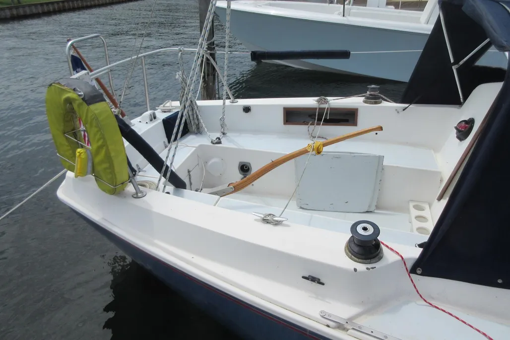 The Pearson 30's cockpit layout seats four adults comfortably for daysailing, though the 4-ft. tiller encroaches on living space. An optional roller-bearing mainsheet traveler is recommended for effective mainsail trim. Courtesy of YachtWorld.com