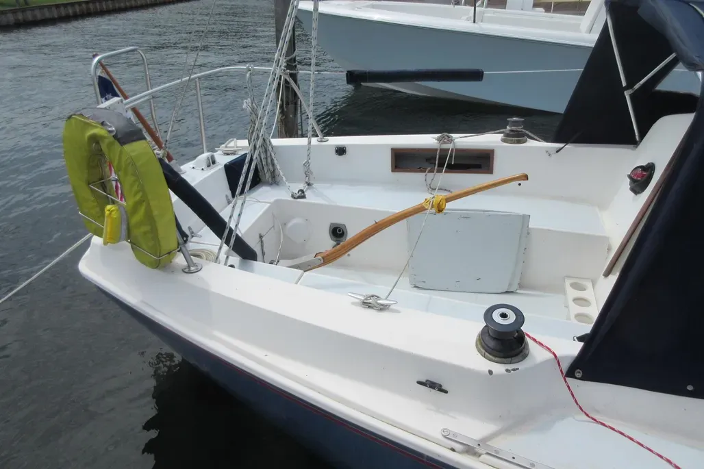 The Pearson 30's cockpit layout seats four adults comfortably for daysailing, though the 4-ft. tiller encroaches on living space. An optional roller-bearing mainsheet traveler is recommended for effective mainsail trim. Courtesy of YachtWorld.com