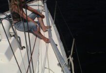 Carey checking out the collision damage. (Photo/ Bert Vermeer)