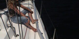 Carey checking out the collision damage. (Photo/ Bert Vermeer)