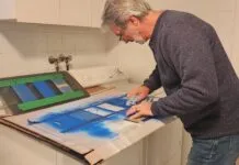 Author doing a rub test and chemical test on samples of canvas painted with exterior fabric paint. (Photo/ Marc Robic)