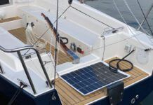 Quiet Power: Electric and Hybrid Propulsion at Annapolis A J/Boats J/9 powered by the optional Torqeedo Cruise 6.0 pod drive, which is mounted in place of a saildrive. The throttle and battery monitor panel are visible on the starboard bench seat. The optional solar panel helps top up the battery when away from dockside power. (Photo/ Doug Henschen)