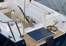 A J/Boats J/9 powered by the optional Torqeedo Cruise 6.0 pod drive, which is mounted in place of a saildrive. The throttle and battery monitor panel are visible on the starboard bench seat. The optional solar panel helps top up the battery when away from dockside power. (Photo/ Doug Henschen)