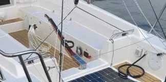 A J/Boats J/9 powered by the optional Torqeedo Cruise 6.0 pod drive, which is mounted in place of a saildrive. The throttle and battery monitor panel are visible on the starboard bench seat. The optional solar panel helps top up the battery when away from dockside power. (Photo/ Doug Henschen)