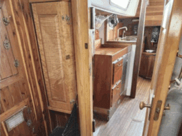 Morgan 41 Used Boat Review The companionway and main cabin entrance showcases classic teak joinery throughout, with abundant storage lockers, a spacious galley to starboard, and traditional teak-and-holly sole. The deep companionway sill provides a secure threshold for offshore passages. Courtesy of SailboatListings.com