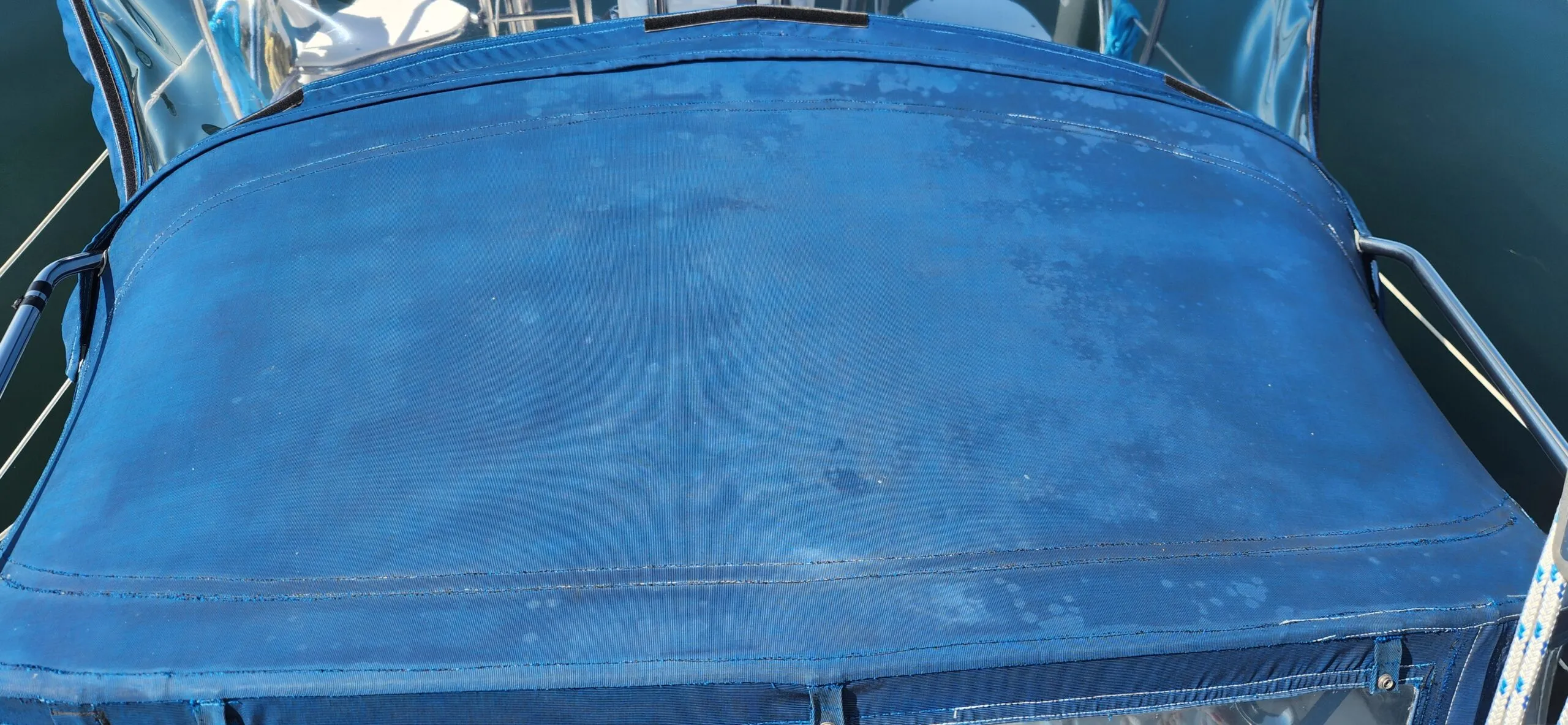 The top of the 20-year-old canvas dodger is showing significant staining and fading, despite regular maintenance and winter storage. (Photo/ Marc Robic)