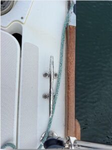 The line comes up from the buoy and is simply laid along the outboard side of the cleat. (Photo/ Bert Vermeer)