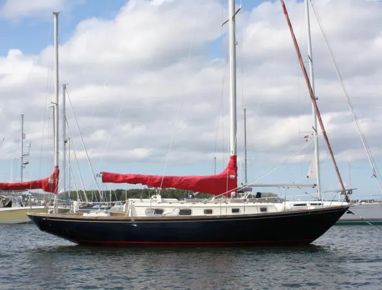 The Bristol 40's low freeboard and narrow cabin trunk are typical of traditional yachts. The long cockpit provides ample seating for daysailing but may be vulnerable to boarding seas in heavy offshore conditions. Courtesy of YachtWorld.com