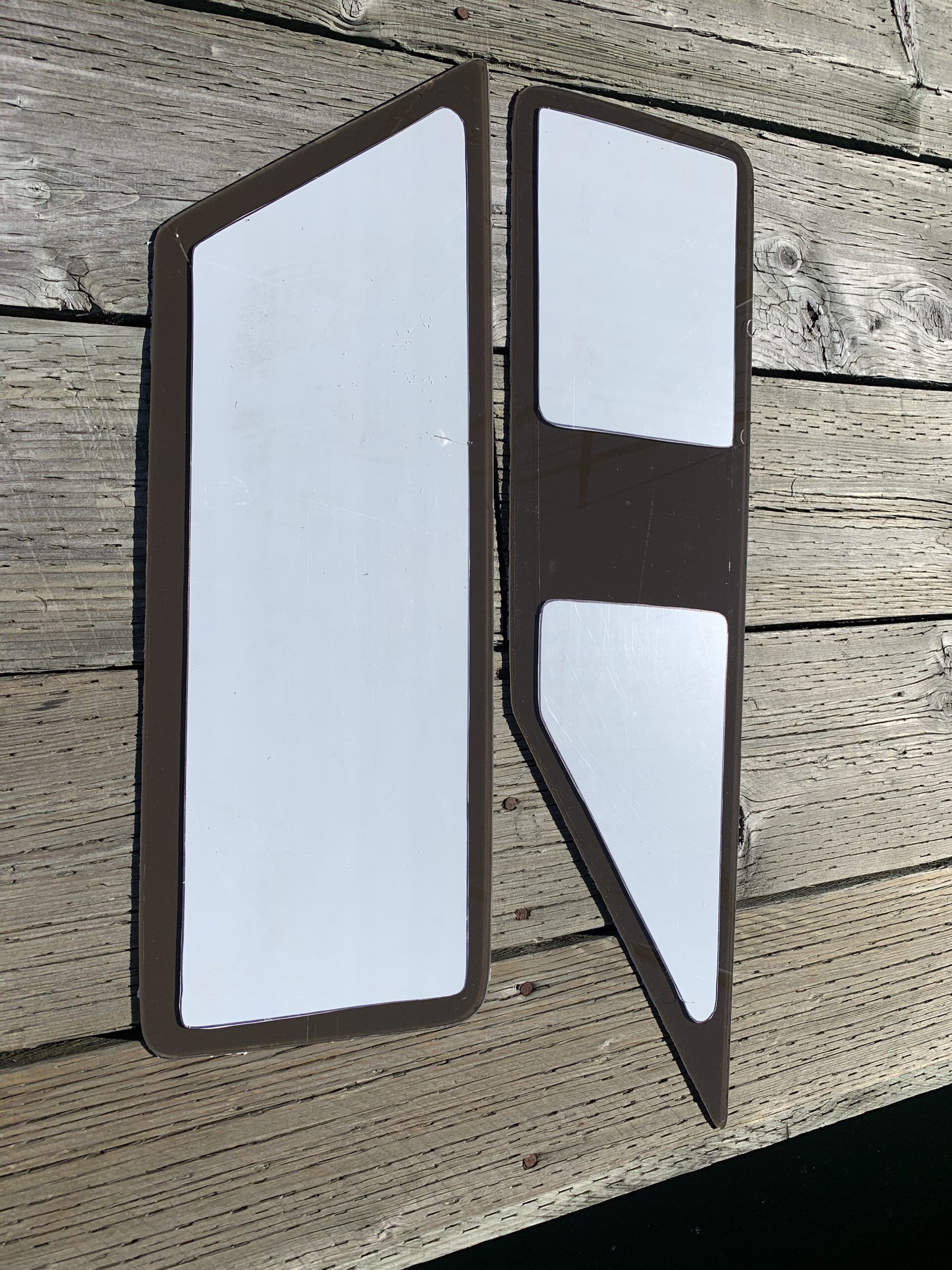 The replacement plexiglass ready for installation. Note the protective cover trimmed back with the Sika Primer 209D ++ painted on the inside edge. (Photo/ Bert Vermeer)