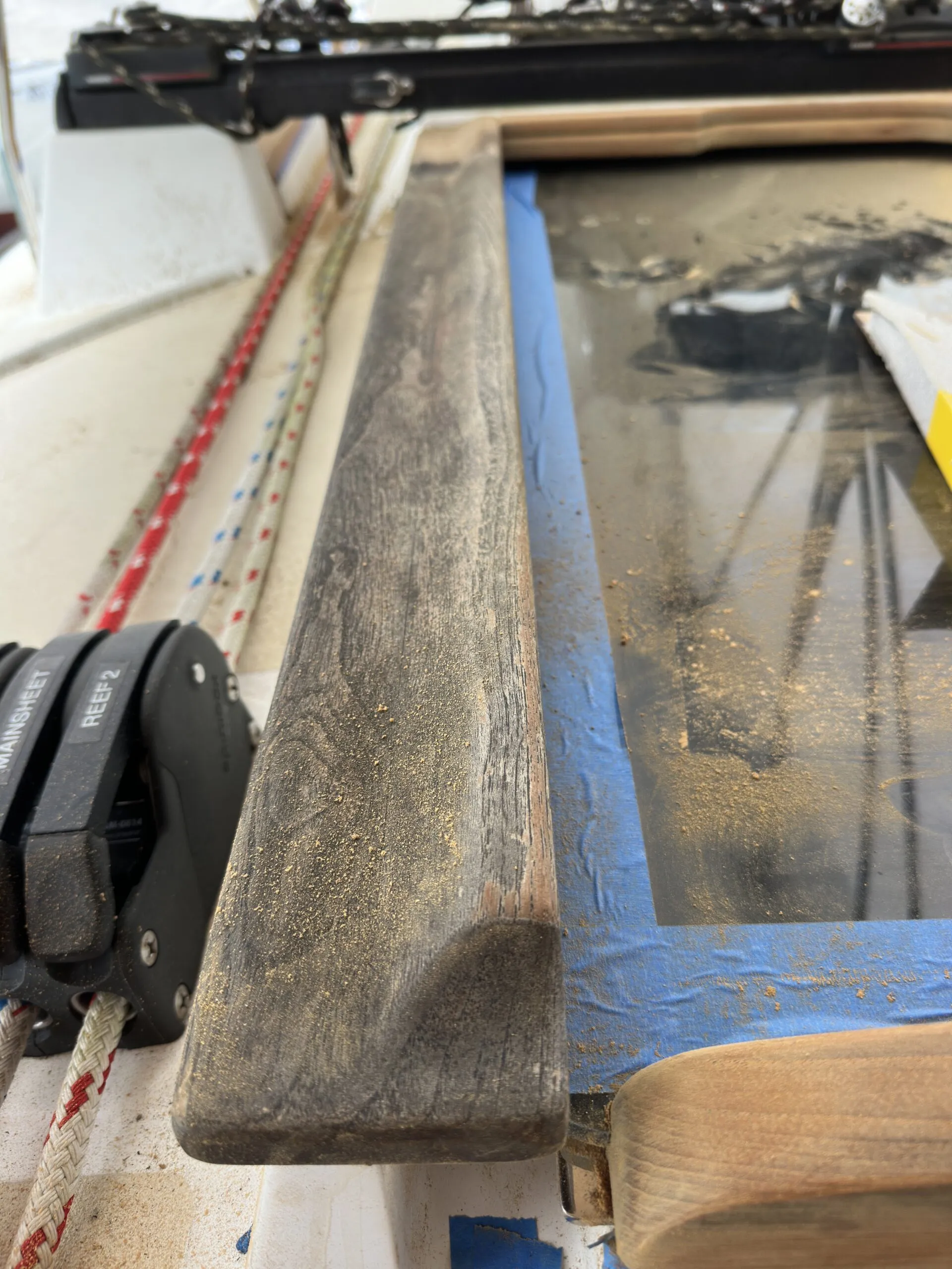 Badly weathered cockpit slide on a 2009 Tartan 3700. No finish had ever been applied and the teak had deteriorated almost to the point of no recovery. (Photo/ Bert Vermeer)