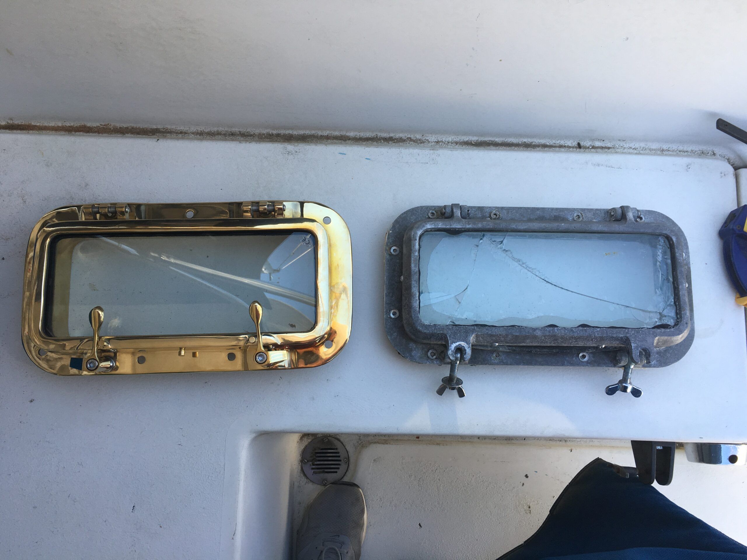 Portlight comparison: the old aluminum and the new bronze. (Photo/ Bert Vermeer)