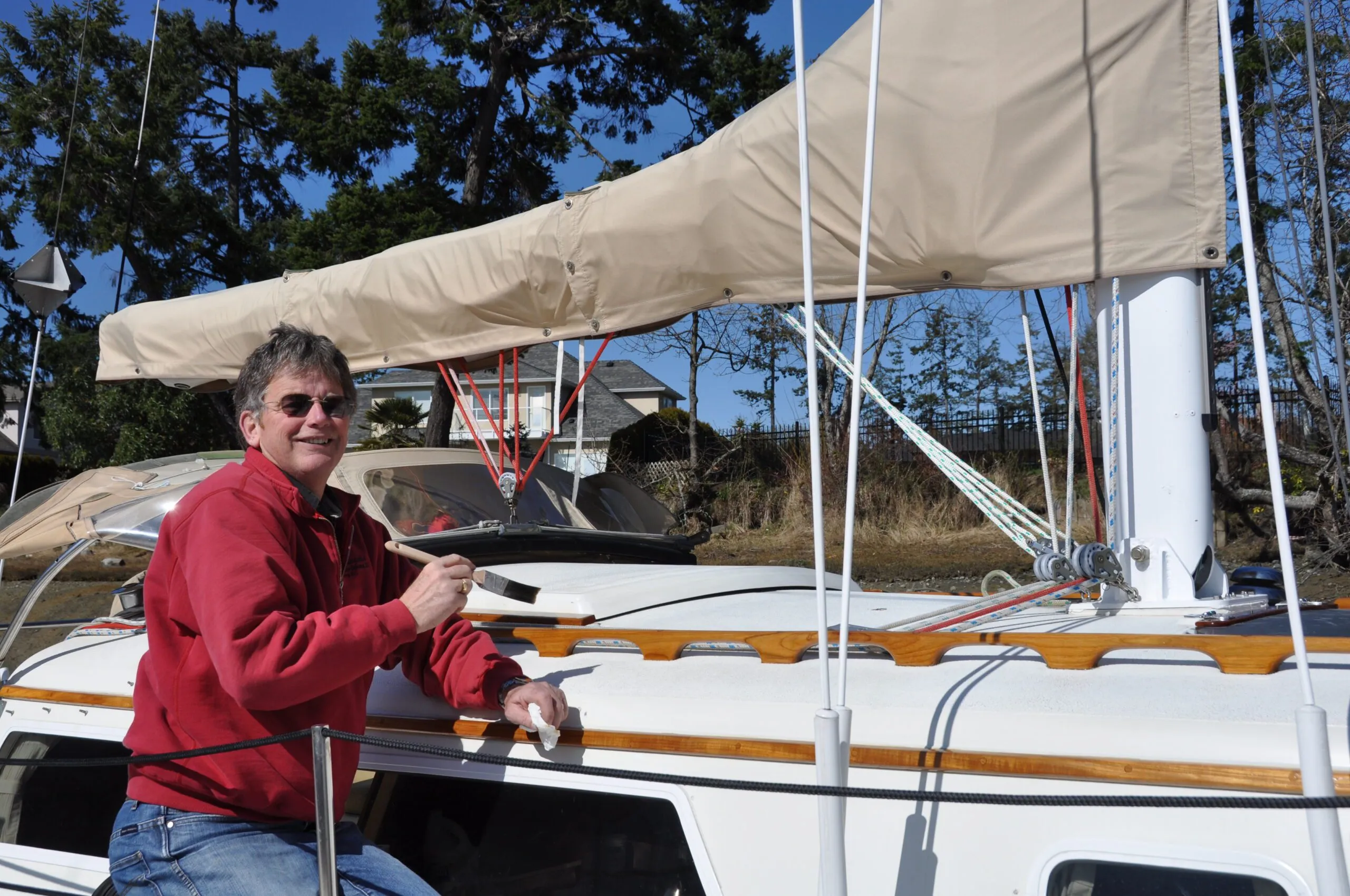 The author applying an additional two coats of Deks Olje as part of the spring ritual. (Photo/ Bert Vermeer)