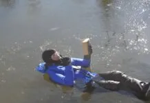 Dry Suit Versus Immersion Suit: A More Practical Solution? Reading Isaac Asimov. To demonstrate humorously, but also accurately, that I spent considerable time in ice water for the test. It was as comfortable like a water bed and reading helped pass the time. In between I performed climbing, jumping, and boarding tests, as required by the immersion suit standard. I swam around the harbor a little bit, because I could and because with some ice on the water, there was zero traffic. (Photo/ Drew Frye)