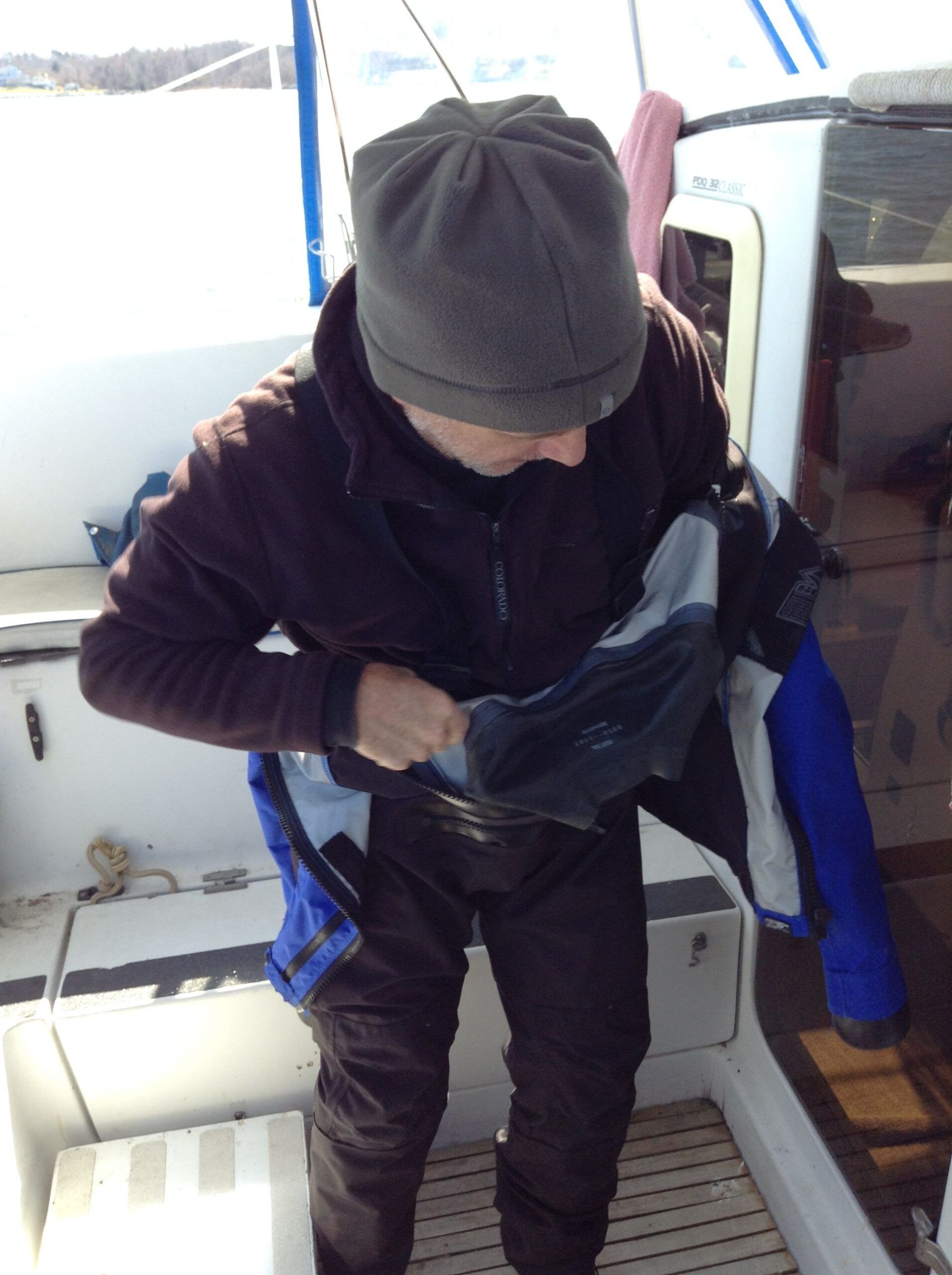 Donning the dry suit with fleece clothing layers underneath. (Photo/ Drew Frye)