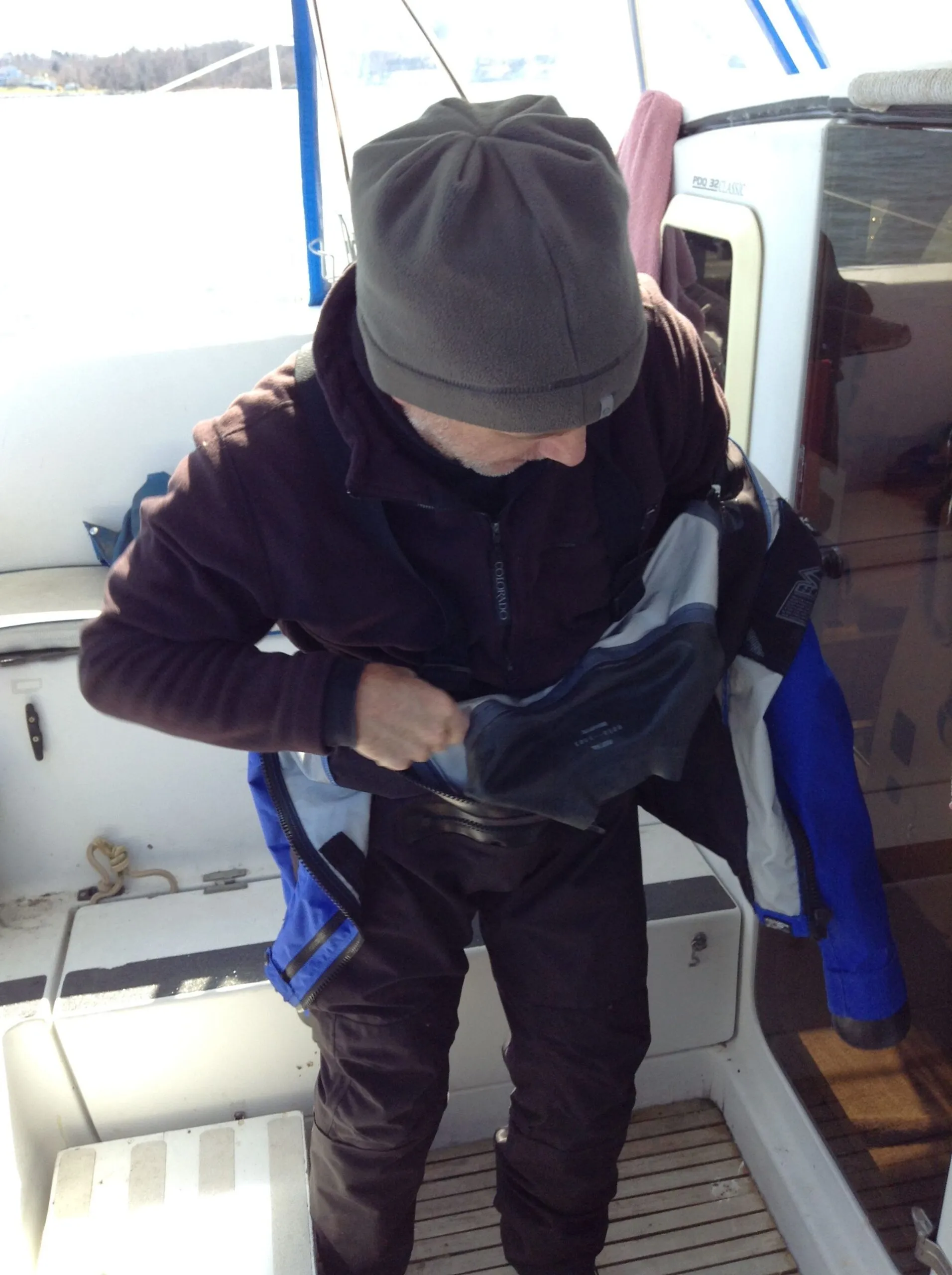 Donning the dry suit with fleece clothing layers underneath. (Photo/ Drew Frye)