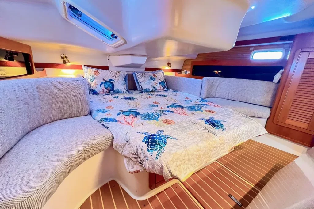 The island bed with access on both sides—a signature feature that sets the Catalina 380 apart from rivals like the Beneteau 373—provides genuine comfort for cruising couples and ample headroom for taller sailors, making the spacious master stateroom a major selling point among owners. Image courtesy of YachtWorld.com