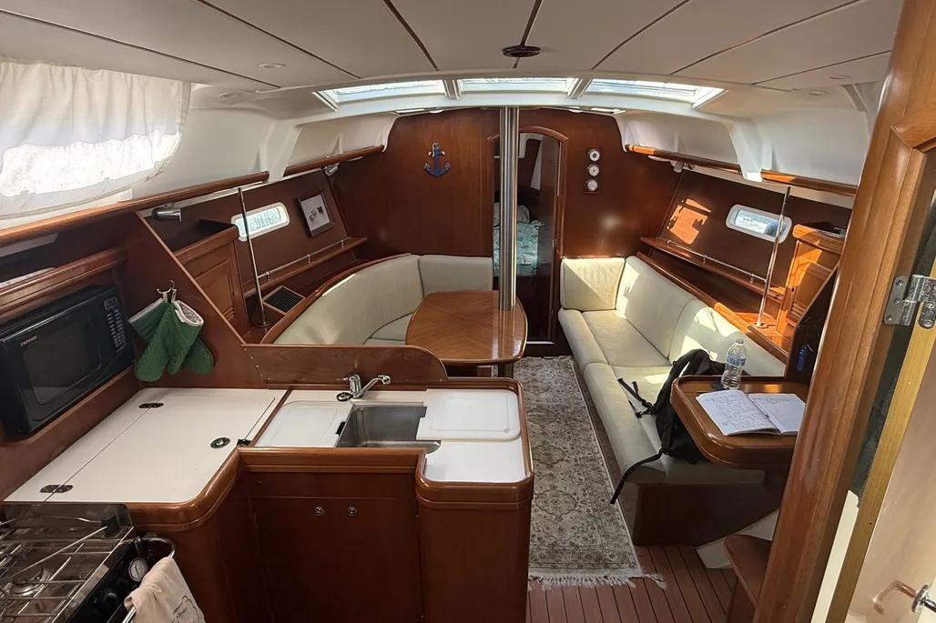 Sharing the Catalina 380's footprint and price point around $80,000, the Beneteau offers similar galley and cabin layouts with comparable sailing performance at PHRF 130, yet falls short in displacement and seaworthiness. Image courtesy of YachtWorld.com